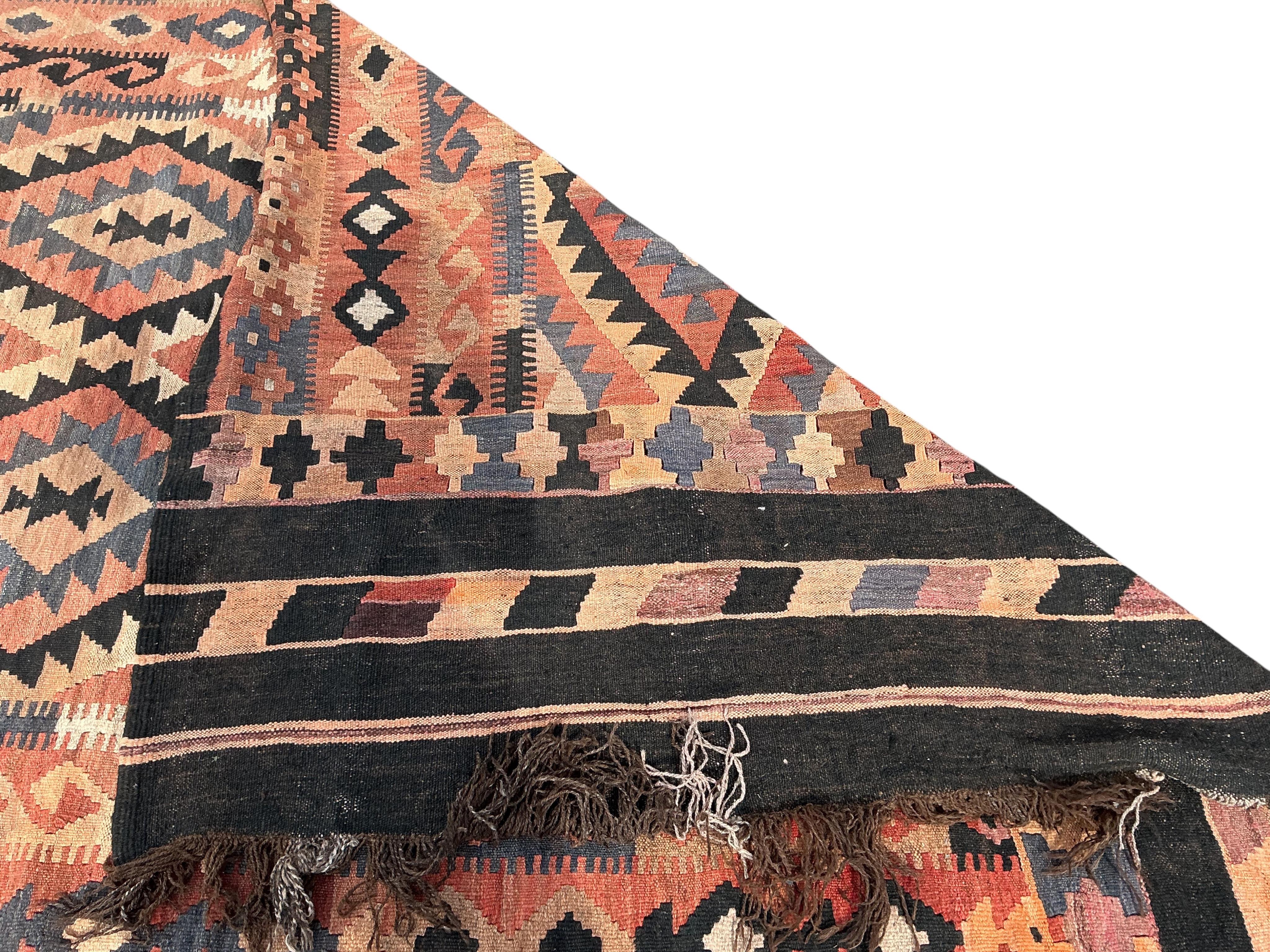 A Kilim polychrome flatweave carpet, 240 x 180cm